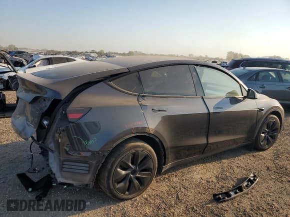 ✅ 2025 Tesla Model Y Long Range • VIN: 7SAYGAEE2SF218229 • Lot: 84790895. Listed on Copart with 51,018 mi. Free auction sales archive from the USA and detailed vehicle history report at DreamBid. Image 3.