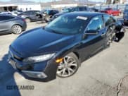 ✅ 2021 Honda Civic Touring • VIN: 19XFC1F99ME201406 • Lot: 82574835. Listed on Copart with 18,879 mi. Free auction sales archive from the USA and detailed vehicle history report at DreamBid. Image 1.