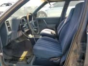 ✅ 1985 Pontiac Sunbird • VIN: 1G2JB350XF7575719 • Lot: 60540725. Listed on Copart with 60,511 mi. Free auction sales archive from the USA and detailed vehicle history report at DreamBid. Image 7.