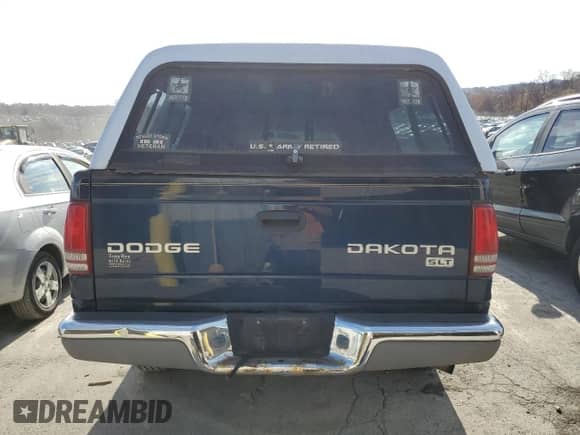 2004 Dodge Dakota SLT with VIN 1D7HG48N24S528189, listed as a Copart auction lot 79819114 with 203,056 mi miles and Salvage title. Bid and sale history available at DreamBid. Image 6.