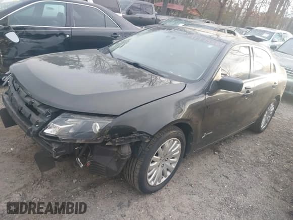 ✅ 2011 Ford Fusion Hybrid • VIN: 3FADP0L37BR171324 • Lot: 41775564. Listed on IAAI with 169,496 mi. Free auction sales archive from the USA and detailed vehicle history report at DreamBid. Image 2.