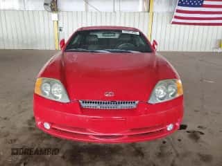 2003 Hyundai Tiburon GT z VIN KMHHN65F53U086483, wystawiony jako Copart lot #53391495 z przebiegiem 153 544 mil mil oraz Szkoda całkowita • Salvage title. Historia ofert i sprzedaży dostępna na DreamBid. Obrazek 5.