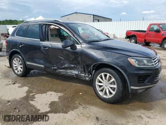 ✅ 2016 Volkswagen Touareg Sport • VIN: WVGEF9BP3GD008823 • Lot: 56838985. Listed on Copart with 49,612 mi. Free auction sales archive from the USA and detailed vehicle history report at DreamBid. Image 4.