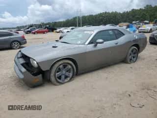 2012 Dodge Challenger R/T z VIN 2C3CDYBT1CH201725, wystawiony jako Copart lot #69679104 z przebiegiem 174 416 mil mil oraz Szkoda całkowita • Salvage title. Historia ofert i sprzedaży dostępna na DreamBid. Obrazek 1.