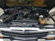 ✅ 1987 Jeep Grand Wagoneer • VIN: 1JCNJ15UXHT043452 • Lot: 86832505. Wystawiony na Copart z przebiegiem 159 429 mil. Bezpłatny archiwum sprzedaży aukcyjnych z USA i szczegółowy raport historii pojazdu na DreamBid. Zdjęcie 12.