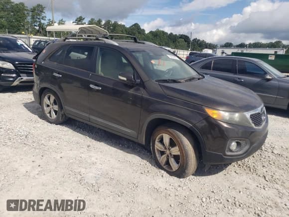 ✅ 2013 Kia Sorento EX • VIN: 5XYKU4A20CG199487 • Lot: 66404625. Listed on Copart with 355,943 mi. Free auction sales archive from the USA and detailed vehicle history report at DreamBid. Image 4.
