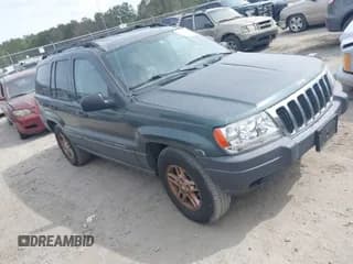 ✅ 2003 Jeep Grand Cherokee • VIN: 1J8GX48S03C614694 • Lot: 41892668. Listed on IAAI with 185,211 mi. Free auction sales archive from the USA and detailed vehicle history report at DreamBid. Image 1.