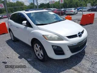 ✅ 2010 Mazda CX-7 Touring • VIN: JM3ER2W35A0333649 • Lot: 42859546. Listed on IAAI with 176,997 mi. Free auction sales archive from the USA and detailed vehicle history report at DreamBid. Image 1.