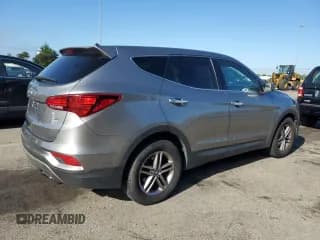 ✅ 2018 Hyundai Santa Fe 2.4L • VIN: 5NMZTDLB2JH108009 • Лот: 58174364. Опубликован ранее на Copart с пробегом 125 784 миль. Бесплатный доступ к архиву аукционных продаж из США и подробный отчёт об истории автомобиля на DreamBid. Изображение 3.