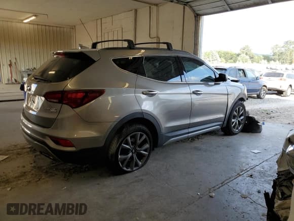 ✅ 2017 Hyundai Santa Fe Ultimate • VIN: 5XYZW4LA5HG497506 • Лот: 66890923. Опубликован ранее на Copart с пробегом Не указан. Бесплатный доступ к архиву аукционных продаж из США и подробный отчёт об истории автомобиля на DreamBid. Изображение 3.