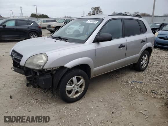 2005 Hyundai Tucson GL z VIN KM8JM12B75U146582, wystawiony jako Copart lot #82966094 z przebiegiem 132 445 mil mil oraz Nie do naprawy • Non repairable. Historia ofert i sprzedaży dostępna na DreamBid. Obrazek 1.