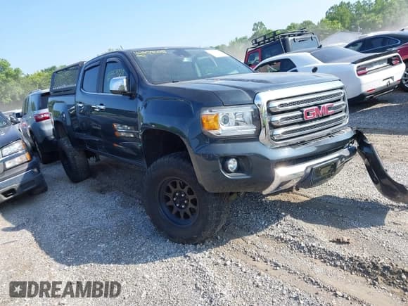 ✅ 2017 GMC Canyon 4WD SLT • VIN: 1GTP6DE17H1213698 • Lot: 42559028. Listed on IAAI with 169,292 mi. Free auction sales archive from the USA and detailed vehicle history report at DreamBid. Image 1.