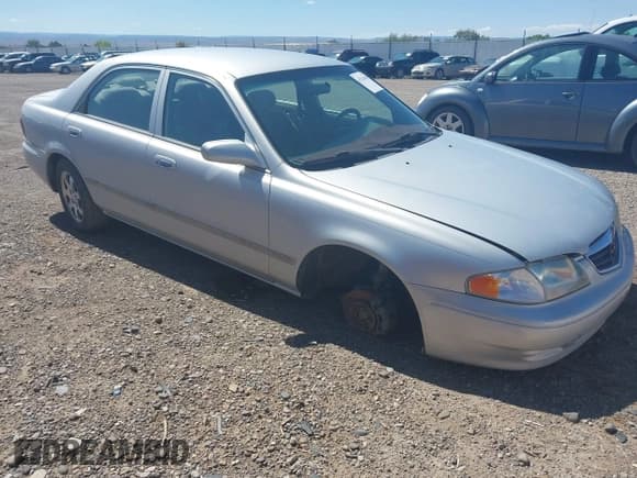 ✅ 2000 Mazda 626 LX • VIN: 1YVGF22C3Y5162620 • Lot: 43216503. Listed on IAAI with Not provided. Free auction sales archive from the USA and detailed vehicle history report at DreamBid. Image 1.
