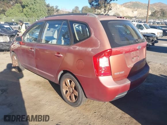 ✅ 2007 Kia Rondo EX • VIN: KNAFG526277118232 • Lot: 43857519. Listed on IAAI with 129,510 mi. Free auction sales archive from the USA and detailed vehicle history report at DreamBid. Image 3.
