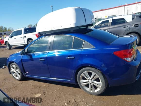 2013 Chevrolet Cruze LTZ z VIN 1G1PG5SBXD7226882, wystawiony jako IAAI lot #43396275 z przebiegiem 140 683 mil mil oraz . Historia ofert i sprzedaży dostępna na DreamBid. Obrazek 14.