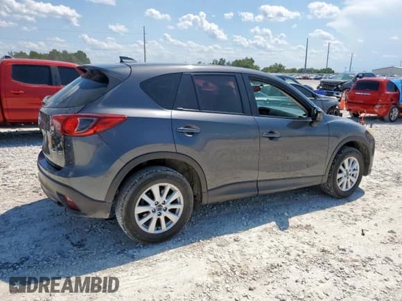 ✅ 2014 Mazda CX-5 Sport • VIN: JM3KE2BE5E0386119 • Lot: 68226855. Listed on Copart with 310,877 mi. Free auction sales archive from the USA and detailed vehicle history report at DreamBid. Image 3.