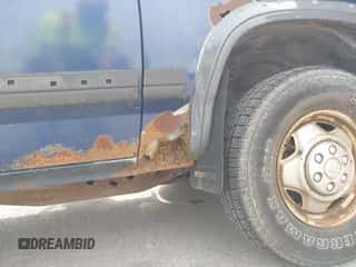 1991 Dodge Dakota z VIN 1B7GG26X3MS259618, wystawiony jako IAAI lot #42316385 z przebiegiem 174 734 mil mil oraz . Historia ofert i sprzedaży dostępna na DreamBid. Obrazek 6.