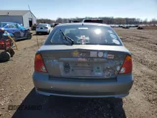 2005 Hyundai Accent GLS z VIN KMHCG35C65U331867, wystawiony jako Copart lot #49637495 z przebiegiem 63 901 mil mil oraz Czysty tytuł • Clean title. Historia ofert i sprzedaży dostępna na DreamBid. Obrazek 6.