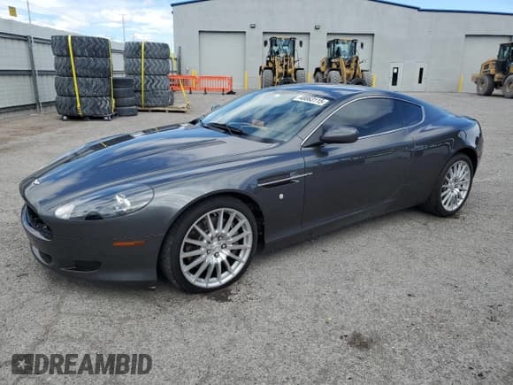 ✅ 2007 Aston Martin DB9 • VIN: SCFAD01A77GA07808 • Лот: 48063115. Опубликован ранее на Copart с пробегом 53 195 миль. Бесплатный доступ к архиву аукционных продаж из США и подробный отчёт об истории автомобиля на DreamBid. Изображение 1.