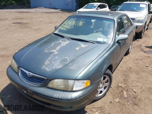 ✅ 1999 Mazda 626 ES • VIN: 1YVGF22C1X5836200 • Lot: 42471226. Listed on IAAI with 84,844 mi. Free auction sales archive from the USA and detailed vehicle history report at DreamBid. Image 6.