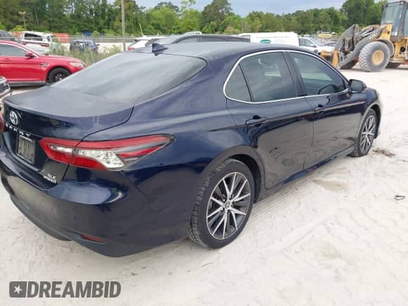 2022 Toyota Camry Hybrid XLE with VIN 4T1F31AK4NU591517, listed as a IAAI auction lot 42216959 with 36,048 mi miles and . Bid and sale history available at DreamBid. Image 4.