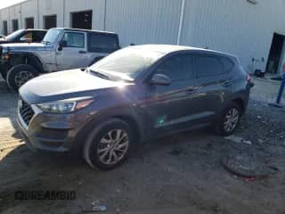 2019 Hyundai Tucson SE with VIN KM8J23A44KU910291, listed as a Copart auction lot 86820405 with 61,875 mi miles and Salvage title. Bid and sale history available at DreamBid. Image 1.