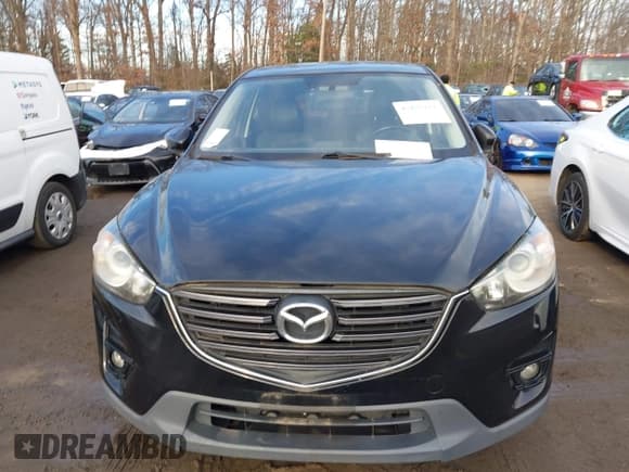 ✅ 2016 Mazda CX-5 Grand Touring • VIN: JM3KE4DY8G0834567 • Lot: 43837311. Wystawiony na IAAI z przebiegiem Nie podano. Bezpłatny archiwum sprzedaży aukcyjnych z USA i szczegółowy raport historii pojazdu na DreamBid. Zdjęcie 6.