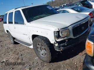 ✅ 2000 Cadillac Escalade • VIN: 1GYEK63R7YR226034 • Lot: 41224406. Listed on IAAI with 293,123 mi. Free auction sales archive from the USA and detailed vehicle history report at DreamBid. Image 1.