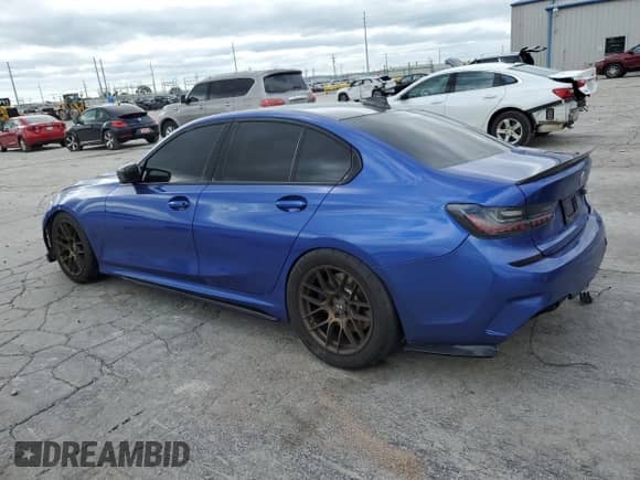2021 BMW 3 Series M340i with VIN 3MW5U7J02M8B53862, listed as a Copart auction lot 61327525 with 99,392 mi miles and Salvage title. Bid and sale history available at DreamBid. Image 2.