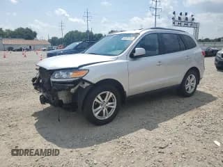 ✅ 2012 Hyundai Santa Fe SE • VIN: 5XYZH4AG8CG121070 • Lot: 69295455. Listed on Copart with 138,134 mi. Free auction sales archive from the USA and detailed vehicle history report at DreamBid. Image 1.