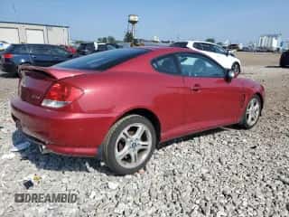 2006 Hyundai Tiburon GT с VIN KMHHN65FX6U190598, выставлен на аукционе Copart как лот 61143675 с пробегом Не указан миль и Списание • Salvage title. История ставок и продаж доступна на DreamBid. Изображение 3.