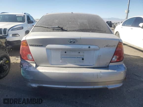 2003 Hyundai Accent GL with VIN KMHCG35C73U263320, listed as a Copart auction lot 88956145 with 191,208 mi miles and Salvage title. Bid and sale history available at DreamBid. Image 6.
