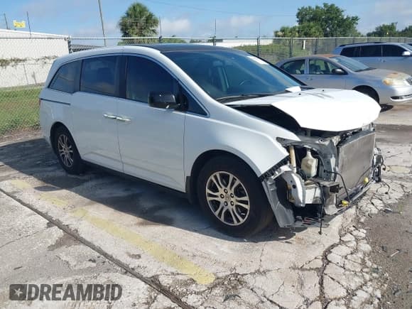 ✅ 2012 Honda Odyssey EX-L • VIN: 5FNRL5H61CB032353 • Lot: 42471691. Listed on IAAI with 186,257 mi. Free auction sales archive from the USA and detailed vehicle history report at DreamBid. Image 1.