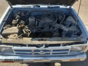 ✅ 1992 Nissan Frontier SE • VIN: 1N6HD16Y8NC358458 • Лот: 62064905. Опубликован ранее на Copart с пробегом 226 678 миль. Бесплатный доступ к архиву аукционных продаж из США и подробный отчёт об истории автомобиля на DreamBid. Изображение 11.