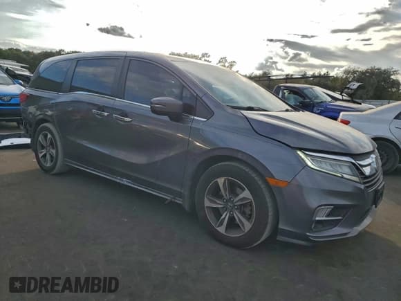 ✅ 2018 Honda Odyssey Touring • VIN: 5FNRL6H85JB029556 • Лот: 94162165. Опубликован ранее на Copart с пробегом 186 037 миль. Бесплатный доступ к архиву аукционных продаж из США и подробный отчёт об истории автомобиля на DreamBid. Изображение 4.