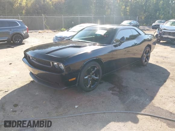 ✅ 2014 Dodge Challenger SXT • VIN: 2C3CDYAG1EH277288 • Lot: 43626237. Listed on IAAI with 104,731 mi. Free auction sales archive from the USA and detailed vehicle history report at DreamBid. Image 18.