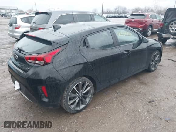 2019 Hyundai Veloster Premium z VIN KMHTG6AF0KU019038, wystawiony jako IAAI lot #41236750 z przebiegiem 83 164 mil mil oraz . Historia ofert i sprzedaży dostępna na DreamBid. Obrazek 4.