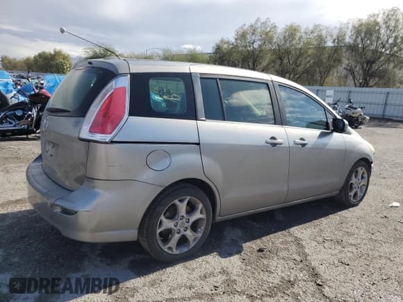 ✅ 2010 Mazda 5 Touring • VIN: JM1CR2W35A0382981 • Лот: 92050545. Опубликован ранее на Copart с пробегом 126 939 миль. Бесплатный доступ к архиву аукционных продаж из США и подробный отчёт об истории автомобиля на DreamBid. Изображение 3.
