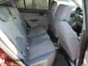 2010 Hyundai Accent GLS z VIN KMHCN4AC6AU423086, wystawiony jako Copart lot #62217374 z przebiegiem 205 962 mil mil oraz Szkoda całkowita • Salvage title. Historia ofert i sprzedaży dostępna na DreamBid. Obrazek 10.