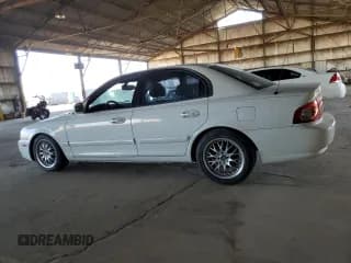 ✅ 2005 Kia Optima LX • VIN: KNAGD126255389712 • Лот: 43856395. Опубликован ранее на Copart с пробегом 201 079 миль. Бесплатный доступ к архиву аукционных продаж из США и подробный отчёт об истории автомобиля на DreamBid. Изображение 2.