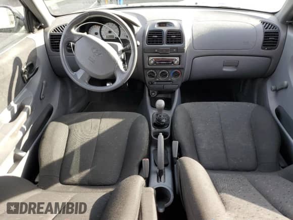 2005 Hyundai Accent GLS с VIN KMHCG35C35U364132, выставлен на аукционе Copart как лот 47227385 с пробегом 177 143 миль миль и Списание • Salvage title. История ставок и продаж доступна на DreamBid. Изображение 8.