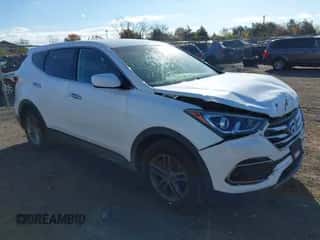 2017 Hyundai Santa Fe 2.4L z VIN 5XYZTDLB9HG396986, wystawiony jako IAAI lot #43523683 z przebiegiem 83 426 mil mil oraz . Historia ofert i sprzedaży dostępna na DreamBid. Obrazek 1.