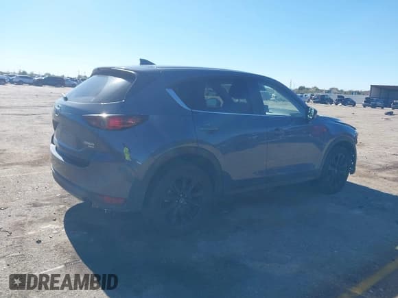 ✅ 2021 Mazda CX-5 Carbon Edition • VIN: JM3KFACY3M0375683 • Lot: 40902292. Listed on IAAI with 60,659 mi. Free auction sales archive from the USA and detailed vehicle history report at DreamBid. Image 4.