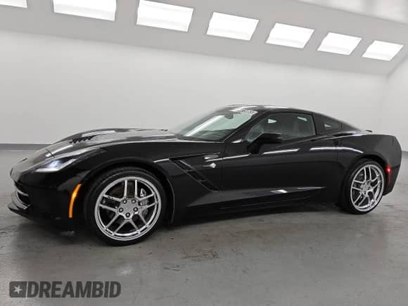 ✅ 2015 Chevrolet Corvette 3LT • VIN: 1G1YE2D72F5107093 • Lot: 84415065. Listed on Copart with 67,909 mi. Free auction sales archive from the USA and detailed vehicle history report at DreamBid. Image 1.