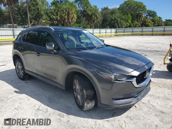 ✅ 2019 Mazda CX-5 Grand Touring • VIN: JM3KFADM7K0622051 • Lot: 86213585. Listed on Copart with 68,022 mi. Free auction sales archive from the USA and detailed vehicle history report at DreamBid. Image 4.