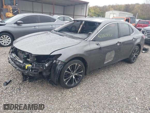 ✅ 2019 Toyota Camry LE • VIN: 4T1B11HK2KU205294 • Лот: 43652792. Опубликован ранее на IAAI с пробегом 99 493 миль. Бесплатный доступ к архиву аукционных продаж из США и подробный отчёт об истории автомобиля на DreamBid. Изображение 2.