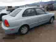 2003 Hyundai Accent GL z VIN KMHCG45C43U465523, wystawiony jako IAAI lot #40883056 z przebiegiem 95 770 mil mil oraz . Historia ofert i sprzedaży dostępna na DreamBid. Obrazek 4.