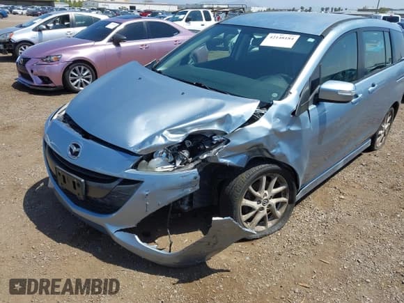 ✅ 2013 Mazda 5 Touring • VIN: JM1CW2CL8D0145628 • Lot: 42148184. Listed on IAAI with 137,150 mi. Free auction sales archive from the USA and detailed vehicle history report at DreamBid. Image 6.