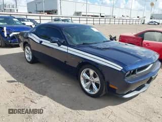 2014 Dodge Challenger R/T with VIN 2C3CDYBT3EH205309, listed as a IAAI auction lot 43205323 with 112,137 mi miles and . Bid and sale history available at DreamBid. Image 1.