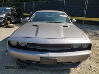 2013 Dodge Challenger SXT z VIN 2C3CDYAG0DH628853, wystawiony jako Copart lot #69860134 z przebiegiem 169 157 mil mil oraz Szkoda całkowita • Salvage title. Historia ofert i sprzedaży dostępna na DreamBid. Obrazek 5.